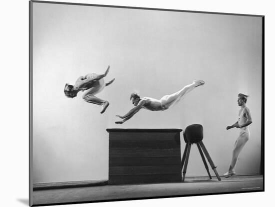 Three Men of Danish Gymnastic Team Performing a Tiger Leap-Gjon Mili-Mounted Photographic Print