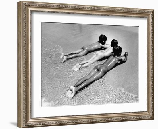 Three Native Boys Sunbathing Nude at the Edge of the Surf at Ocean Beach-Howard Sochurek-Framed Photographic Print