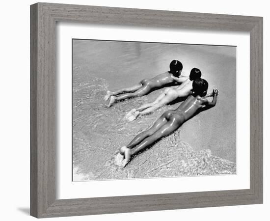 Three Native Boys Sunbathing Nude at the Edge of the Surf at Ocean Beach-Howard Sochurek-Framed Photographic Print