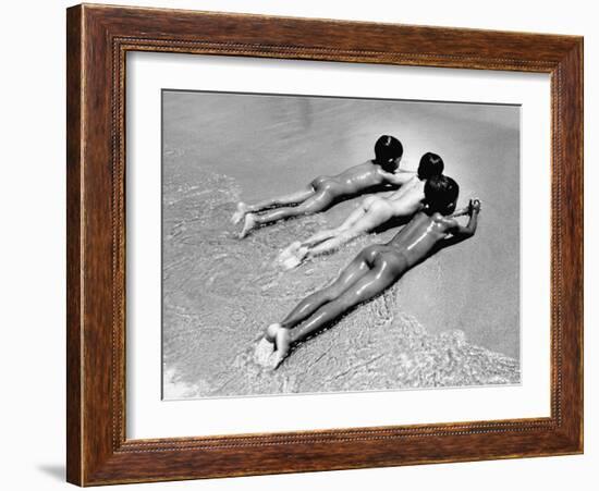 Three Native Boys Sunbathing Nude at the Edge of the Surf at Ocean Beach-Howard Sochurek-Framed Photographic Print