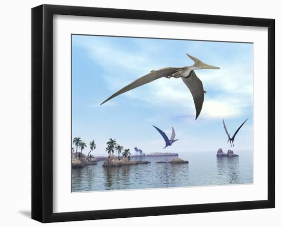 Three Pteranodons Flying over Landscape with Hills, Palm Trees and Water-null-Framed Art Print