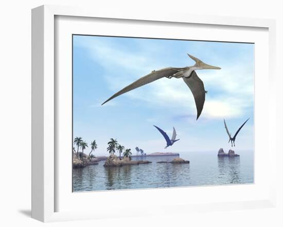 Three Pteranodons Flying over Landscape with Hills, Palm Trees and Water-null-Framed Art Print