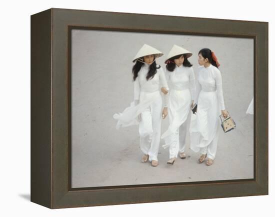 Three Vietnamese Young Women in White Fashion Walking Down the Street-Co Rentmeester-Framed Premier Image Canvas