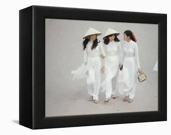 Three Vietnamese Young Women in White Fashion Walking Down the Street-Co Rentmeester-Framed Premier Image Canvas