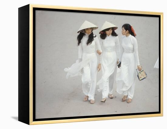 Three Vietnamese Young Women in White Fashion Walking Down the Street-Co Rentmeester-Framed Premier Image Canvas