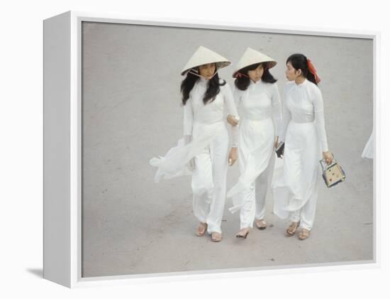 Three Vietnamese Young Women in White Fashion Walking Down the Street-Co Rentmeester-Framed Premier Image Canvas