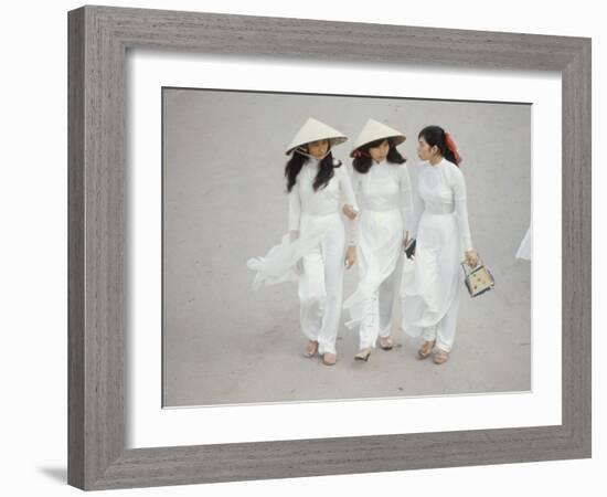 Three Vietnamese Young Women in White Fashion Walking Down the Street-Co Rentmeester-Framed Photographic Print