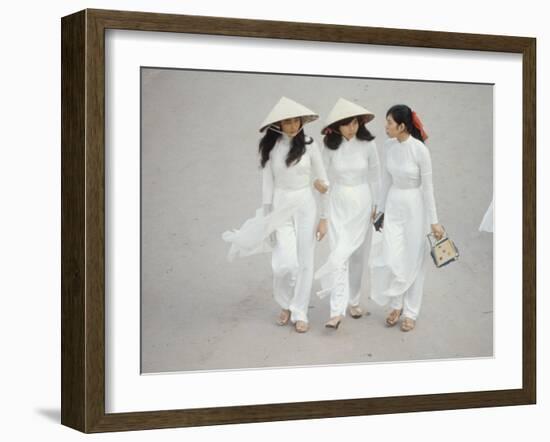 Three Vietnamese Young Women in White Fashion Walking Down the Street-Co Rentmeester-Framed Photographic Print