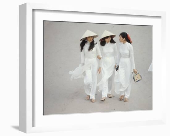 Three Vietnamese Young Women in White Fashion Walking Down the Street-Co Rentmeester-Framed Photographic Print