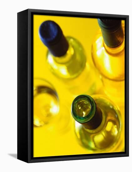 Three White Wine Bottles and a Wine Glass-Ulrike Koeb-Framed Premier Image Canvas