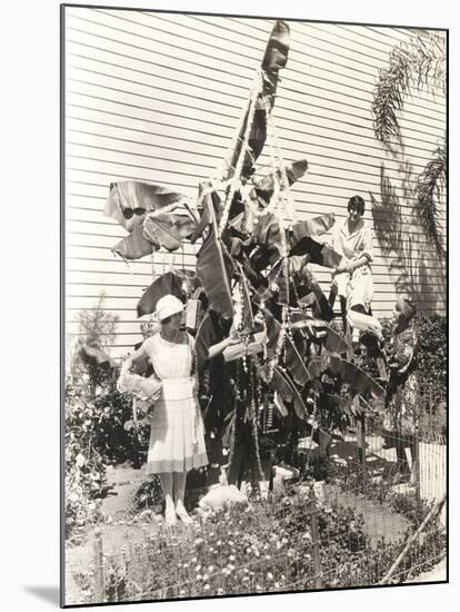 Three Women Decorating Banana Tree for Christmas-null-Mounted Photo