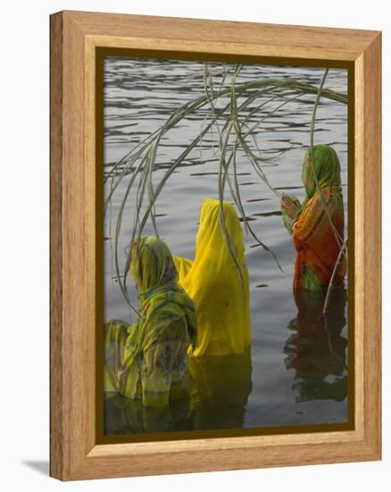 Three Women Pilgrims in Saris Making Puja Celebration in the Pichola Lake at Sunset, Udaipur, India-Eitan Simanor-Framed Premier Image Canvas