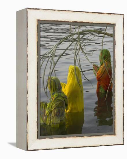 Three Women Pilgrims in Saris Making Puja Celebration in the Pichola Lake at Sunset, Udaipur, India-Eitan Simanor-Framed Premier Image Canvas