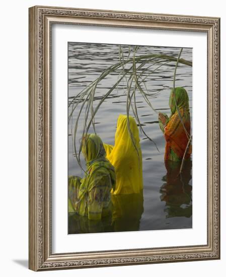 Three Women Pilgrims in Saris Making Puja Celebration in the Pichola Lake at Sunset, Udaipur, India-Eitan Simanor-Framed Photographic Print