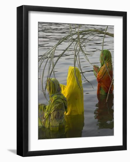 Three Women Pilgrims in Saris Making Puja Celebration in the Pichola Lake at Sunset, Udaipur, India-Eitan Simanor-Framed Photographic Print