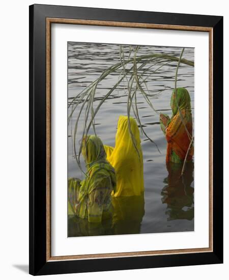 Three Women Pilgrims in Saris Making Puja Celebration in the Pichola Lake at Sunset, Udaipur, India-Eitan Simanor-Framed Photographic Print