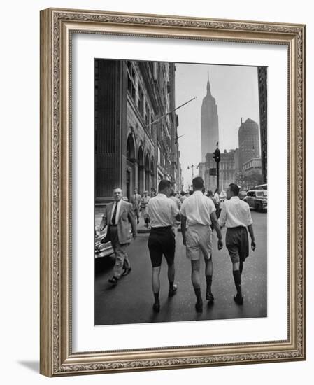 Three Young Businessmen Wearing Bermuda Shorts as They Walk Along Fifth Ave. During Lunchtime-Lisa Larsen-Framed Photographic Print