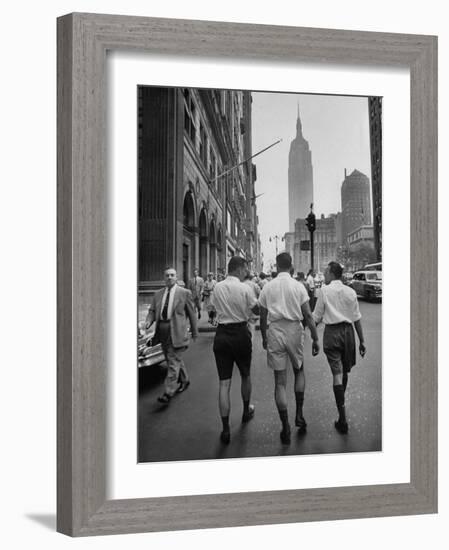 Three Young Businessmen Wearing Bermuda Shorts as They Walk Along Fifth Ave. During Lunchtime-Lisa Larsen-Framed Photographic Print