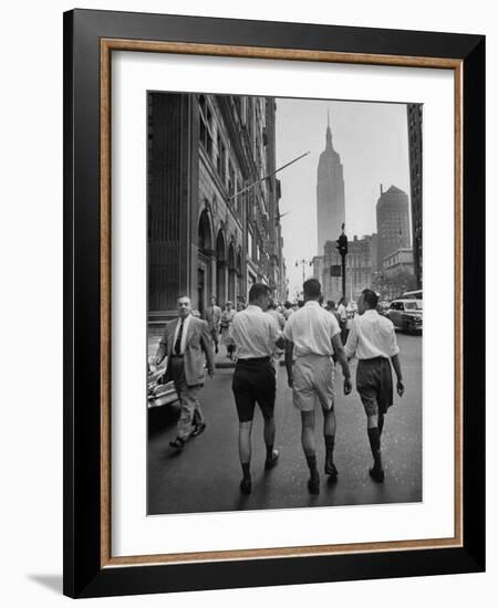 Three Young Businessmen Wearing Bermuda Shorts as They Walk Along Fifth Ave. During Lunchtime-Lisa Larsen-Framed Photographic Print