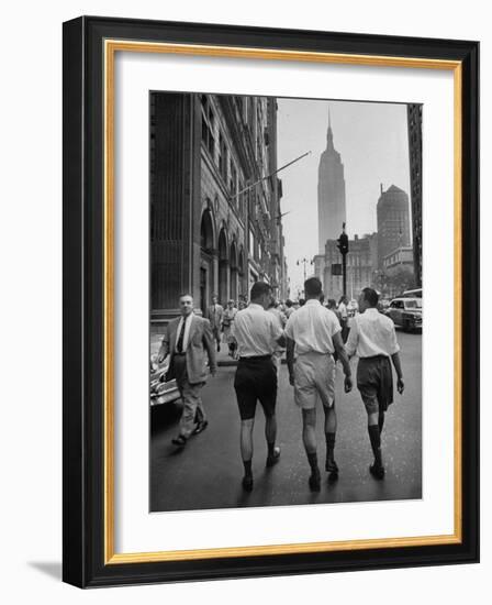 Three Young Businessmen Wearing Bermuda Shorts as They Walk Along Fifth Ave. During Lunchtime-Lisa Larsen-Framed Photographic Print