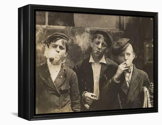 Three Young Newsboys Smoking, Saint Louis, Missouri, USA, circa 1910-Lewis Wickes Hine-Framed Premier Image Canvas