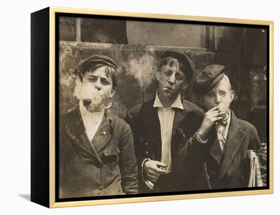 Three Young Newsboys Smoking, Saint Louis, Missouri, USA, circa 1910-Lewis Wickes Hine-Framed Premier Image Canvas