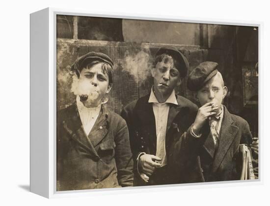 Three Young Newsboys Smoking, Saint Louis, Missouri, USA, circa 1910-Lewis Wickes Hine-Framed Premier Image Canvas