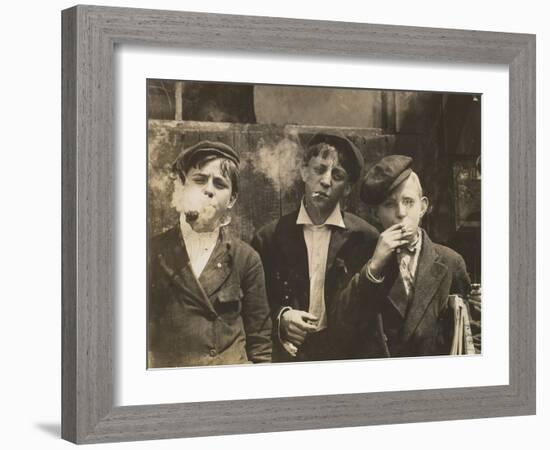 Three Young Newsboys Smoking, Saint Louis, Missouri, USA, circa 1910-Lewis Wickes Hine-Framed Photographic Print