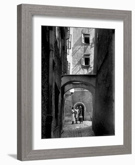 Three Young Women Chatting in Cobbled Alleyway of Old Section of Salzburg-Alfred Eisenstaedt-Framed Photographic Print