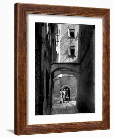 Three Young Women Chatting in Cobbled Alleyway of Old Section of Salzburg-Alfred Eisenstaedt-Framed Photographic Print