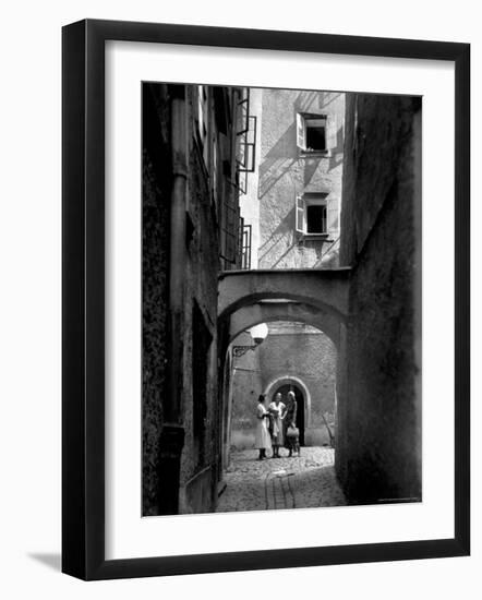 Three Young Women Chatting in Cobbled Alleyway of Old Section of Salzburg-Alfred Eisenstaedt-Framed Photographic Print