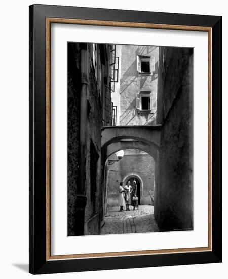 Three Young Women Chatting in Cobbled Alleyway of Old Section of Salzburg-Alfred Eisenstaedt-Framed Photographic Print