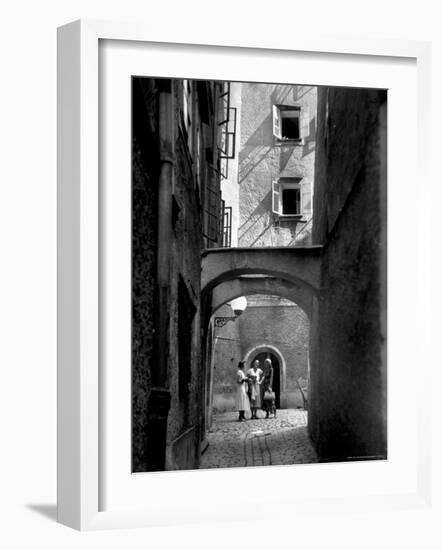 Three Young Women Chatting in Cobbled Alleyway of Old Section of Salzburg-Alfred Eisenstaedt-Framed Photographic Print