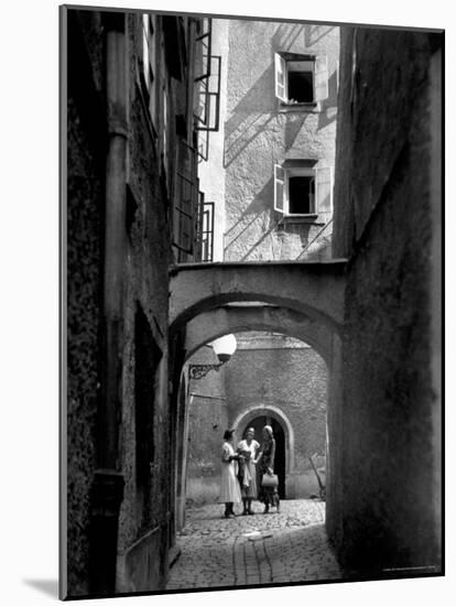 Three Young Women Chatting in Cobbled Alleyway of Old Section of Salzburg-Alfred Eisenstaedt-Mounted Photographic Print