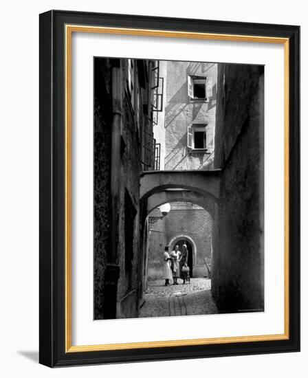 Three Young Women Chatting in Cobbled Alleyway of Old Section of Salzburg-Alfred Eisenstaedt-Framed Photographic Print