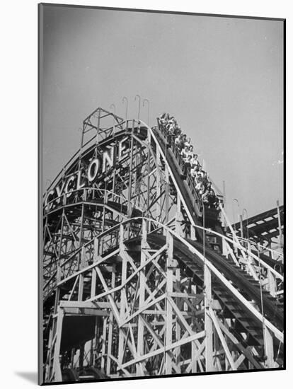 Thrill Seekers at the Top of the Cyclone Roller Coaster at Coney Island Amusement Park-Marie Hansen-Mounted Photographic Print