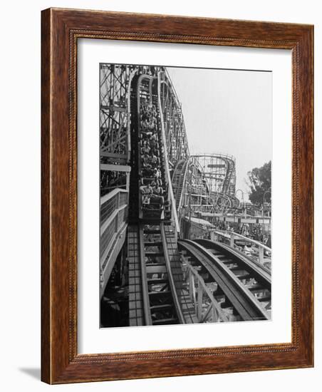 Thrill Seekers Getting a Hair Raising Ride on Cyclone Roller Coaster at Coney Island Amusement Park-Marie Hansen-Framed Photographic Print