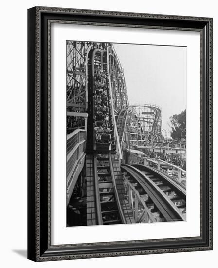 Thrill Seekers Getting a Hair Raising Ride on Cyclone Roller Coaster at Coney Island Amusement Park-Marie Hansen-Framed Photographic Print