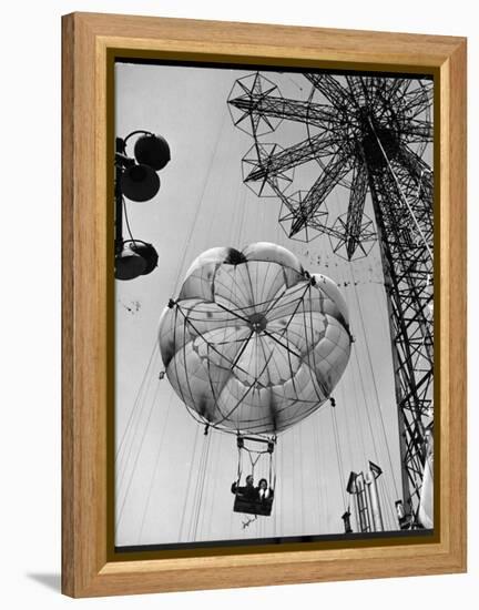 Thrillseeking Couple Take a Ride on the 300-Ft. Parachute Jump at Coney Island Amusement Park-null-Framed Premier Image Canvas