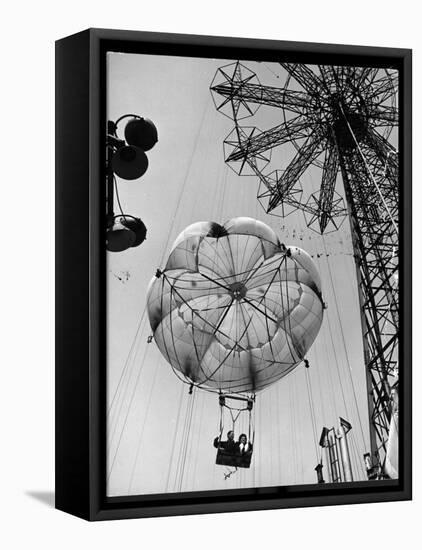 Thrillseeking Couple Take a Ride on the 300-Ft. Parachute Jump at Coney Island Amusement Park-null-Framed Premier Image Canvas