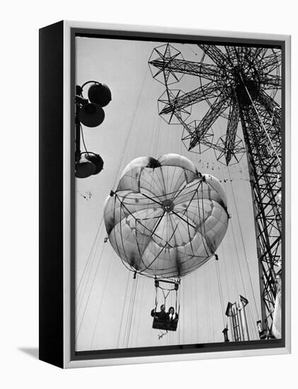 Thrillseeking Couple Take a Ride on the 300-Ft. Parachute Jump at Coney Island Amusement Park-null-Framed Premier Image Canvas