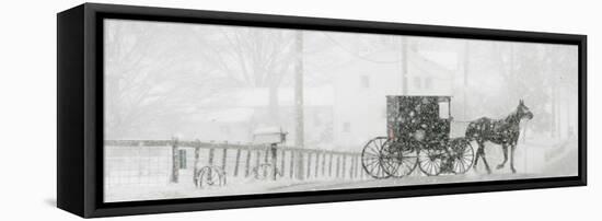 Through a Driving Snow Storm, an Amish Buggy Travels Along a Road in Parkman, Ohio-null-Framed Premier Image Canvas