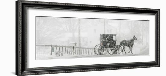 Through a Driving Snow Storm, an Amish Buggy Travels Along a Road in Parkman, Ohio-null-Framed Photographic Print