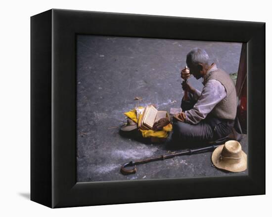 Tibetan Buddhist Pilgrim Reading Texts and Holding Prayer Wheel, Lhasa, China-Alison Wright-Framed Premier Image Canvas