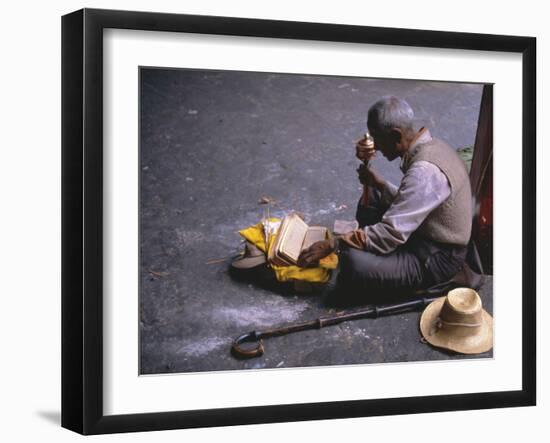 Tibetan Buddhist Pilgrim Reading Texts and Holding Prayer Wheel, Lhasa, China-Alison Wright-Framed Photographic Print