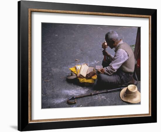 Tibetan Buddhist Pilgrim Reading Texts and Holding Prayer Wheel, Lhasa, China-Alison Wright-Framed Photographic Print