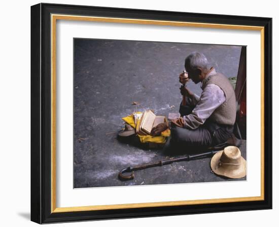 Tibetan Buddhist Pilgrim Reading Texts and Holding Prayer Wheel, Lhasa, China-Alison Wright-Framed Photographic Print