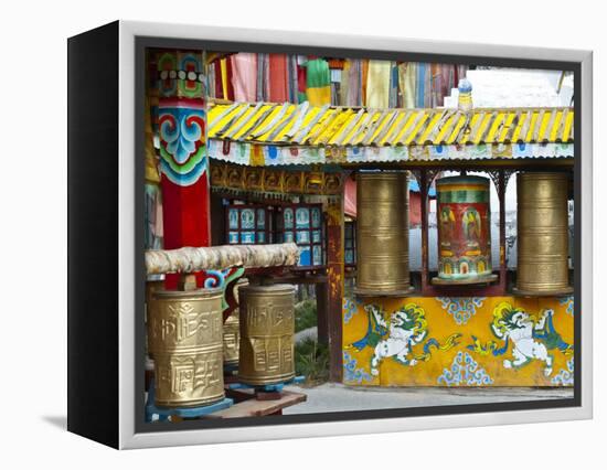 Tibetan Buddhist Prayer Wheels at Shuzheng Village, Sichuan Province, China-Charles Crust-Framed Premier Image Canvas