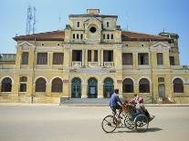 Cyclo Passing the Old Post Office in Phnom Penh in Cambodia, Indochina, Southeast Asia-Tim Hall-Photographic Print