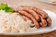Bavarian Fried Sausages on Sauerkraut-Timolina-Framed Premier Image Canvas